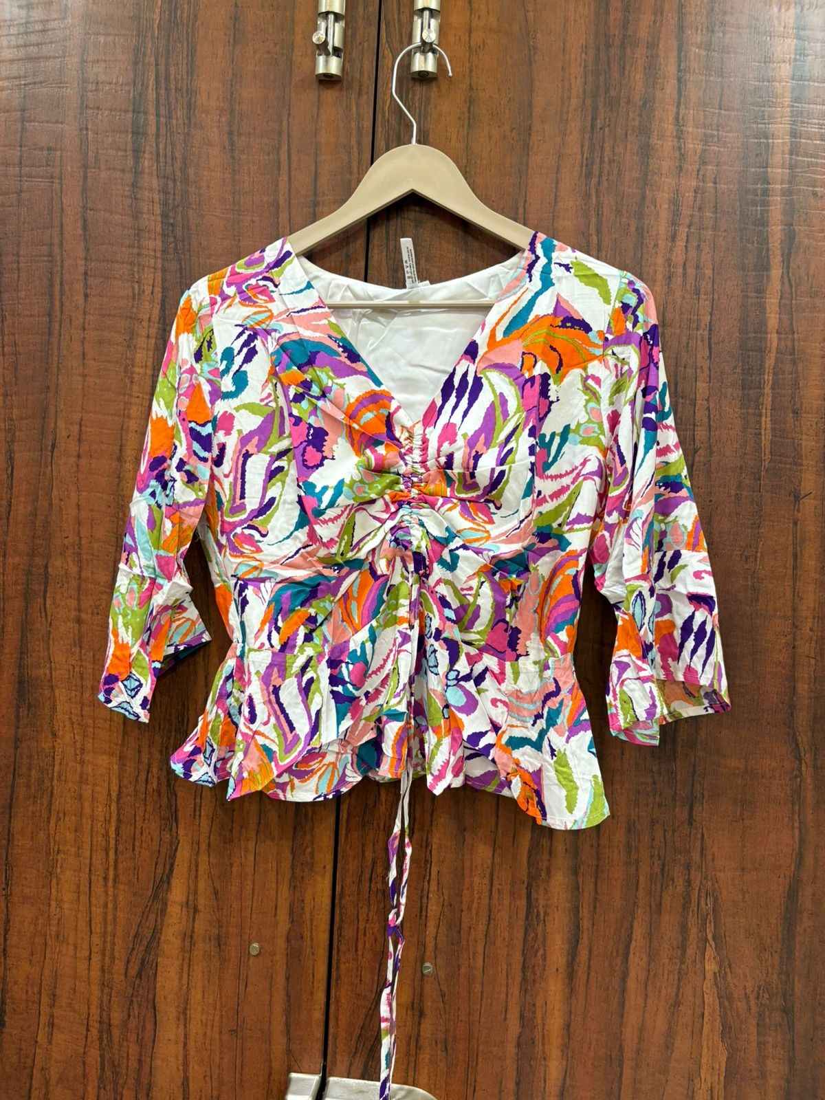 Peplum adjustable top